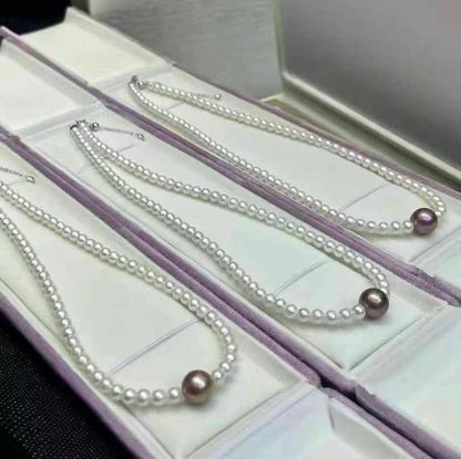 Baby Pearl Necklace Featuring a Purple Pearl | 3–4mm White Accent Pearls & 8–9mm Center Pearl | Sterling Silver Clasp